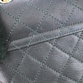 CHANEL | Dark Green Shearling Quilted CC Leather Backpack