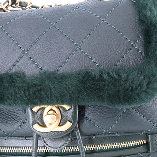 CHANEL | Dark Green Shearling Quilted CC Leather Backpack