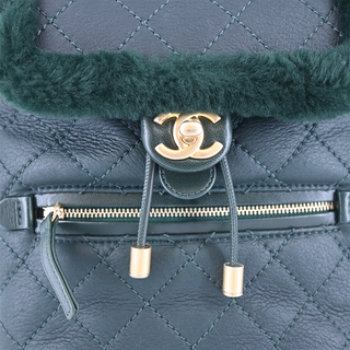 CHANEL | Dark Green Shearling Quilted CC Leather Backpack