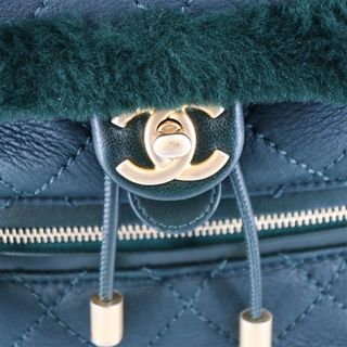 CHANEL | Dark Green Shearling Quilted CC Leather Backpack