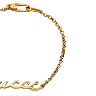 GUCCI | 18K Yellow Gold Script Logo Bracelet