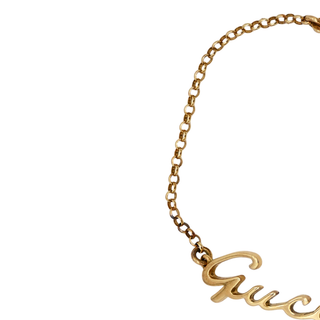 GUCCI | 18K Yellow Gold Script Logo Bracelet