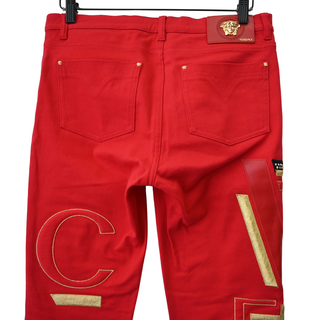 VERSACE | Bright Red 'Versace' Embellished Jeans