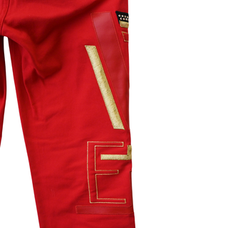 VERSACE | Bright Red 'Versace' Embellished Jeans