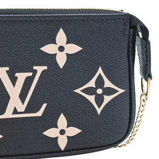 LOUIS VUITTON | Black & Beige Monogram Empreinte Mini Pochette Bag