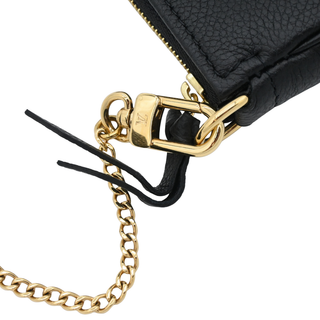 LOUIS VUITTON | Black & Beige Monogram Empreinte Mini Pochette Bag