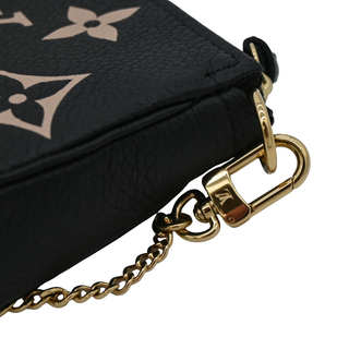 LOUIS VUITTON | Black & Beige Monogram Empreinte Mini Pochette Bag