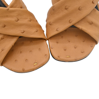 KHAITE | Liria Tan Ostrich Leather Crisscross Mule Sandals