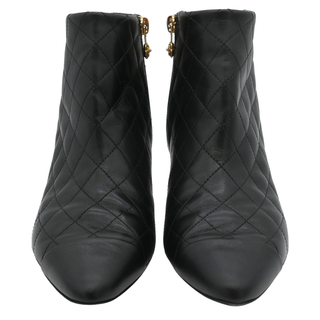 CHANEL | Quilted Leather Camellia Zip Ankle Boots