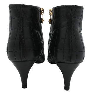 CHANEL | Quilted Leather Camellia Zip Ankle Boots