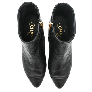 CHANEL | Quilted Leather Camellia Zip Ankle Boots