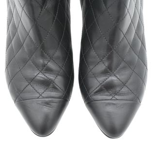 CHANEL | Quilted Leather Camellia Zip Ankle Boots
